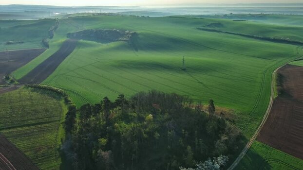 Aerial view of rolling green hills in South Moravian Region Czechia.