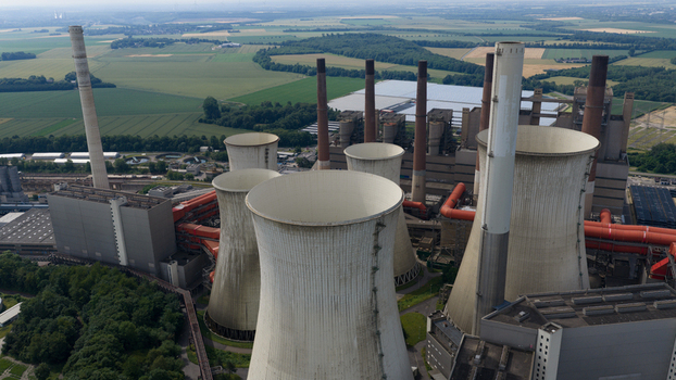Aerial view of Kraftwerk Niederaussem power plant with its iconic cooling towers industrial infrastructure and surrounding green fields in Bergheim Nordrhein Westfalen Germany. Aerial view of Kraftwerk Niederaussem power plant with its iconic cooling towers industrial infrastructure and surrounding green fields in Bergheim Nordrhein Westfalen Germany.