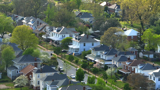 Aerial view of a residential neighborhood with historic houses tree lined streets and lush green foliage in Lynchburg Virginia United States.