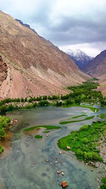 Aerial view of Qullai Vudor peak and river valley Tajikistan. Aerial view of Qullai Vudor peak and river valley Tajikistan.