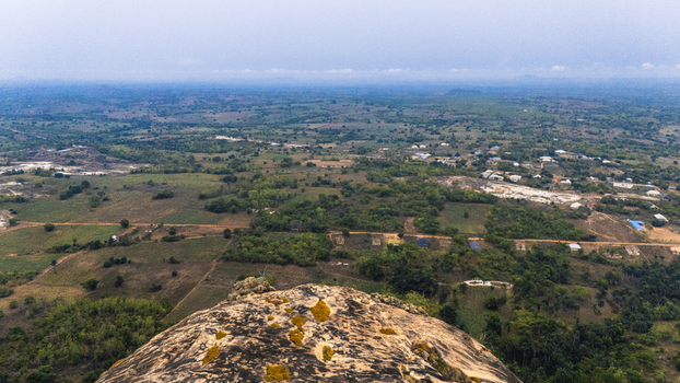 Aerial view of the sprawling landscape with patches of greenery and settlements contrasting with the rugged terrain of Iyake Lake Oyo Nigeria. Aerial view of the sprawling landscape with patches of greenery and settlements contrasting with the rugged terrain of Iyake Lake Oyo Nigeria.