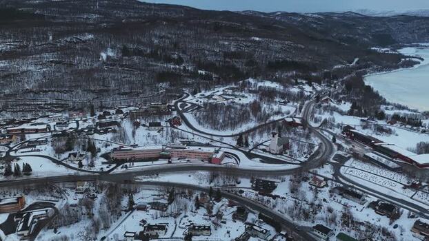 Aerial view of buildings and frozen lake Norway.