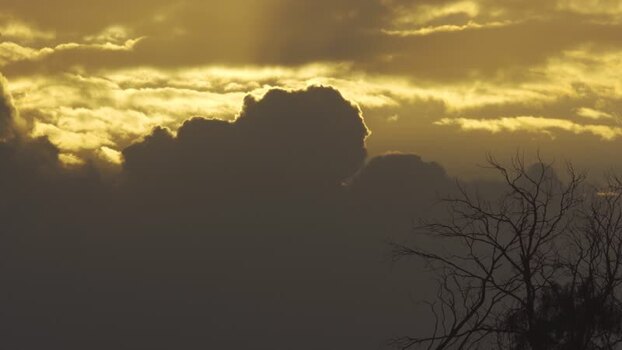 Aerial view of golden hour clouds over the landscape of Algeria.