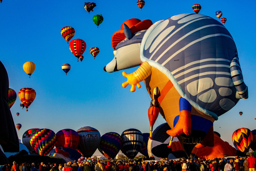 Albuquerque United States 12 October 2017 View of a vibrant armada of hot air balloons including a giant armadillo ascends into the crisp blue New Mexico sky. Albuquerque United States 12 October 2017 View of a vibrant armada of hot air balloons including a giant armadillo ascends into the crisp blue New Mexico sky.