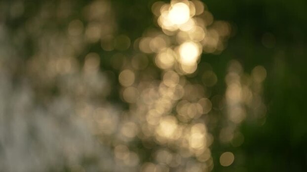 View of out of focus golden bokeh lights on water Bangladesh. View of out of focus golden bokeh lights on water Bangladesh.