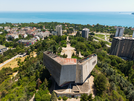 Aerial view of the Monument of the Bulgarian Soviet Friendship surrounded by lush greenery urban buildings and the Black Sea coastline in Varna Varna Bulgaria.
