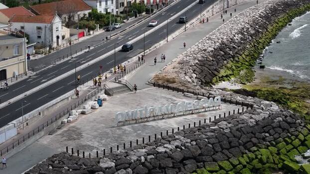 Aerial view of Passeio Maritimo de Alges with people walking Portugal. Aerial view of Passeio Maritimo de Alges with people walking Portugal.