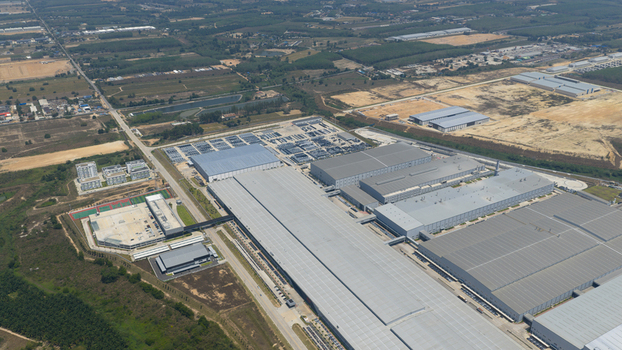 Aerial view of the BYD Thailand Rayong Office Building and industrial complex with modern factory structures and surrounding green fields in Phananikhom Rayong Thailand. Aerial view of the BYD Thailand Rayong Office Building and industrial complex with modern factory structures and surrounding green fields in Phananikhom Rayong Thailand.
