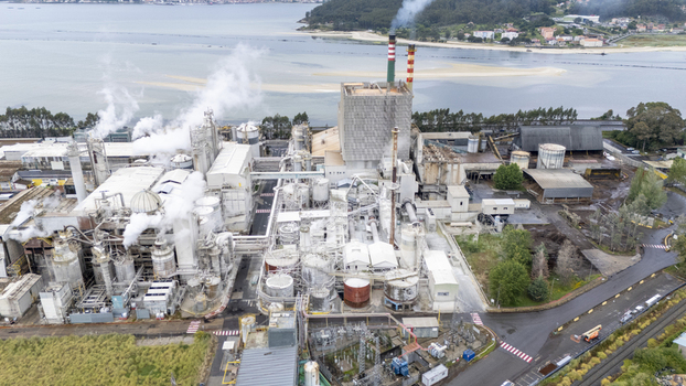 Aerial view of Biofabrica de Ence en Pontevedra with smoking chimneys and industrial structures near the estuary in Pontevedra Pontevedra Spain. Aerial view of Biofabrica de Ence en Pontevedra with smoking chimneys and industrial structures near the estuary in Pontevedra Pontevedra Spain.