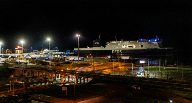 Klaipeda Lithuania 18 September 2026 View of the DFDS ferry docked at the illuminated port of Klaipeda at night featuring shipping containers and industrial infrastructure. Klaipeda Lithuania 18 September 2026 View of the DFDS ferry docked at the illuminated port of Klaipeda at night featuring shipping containers and industrial infrastructure.
