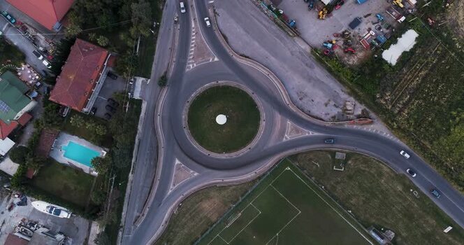 Aerial view of a roundabout with moving cars in Capaccio Italy.