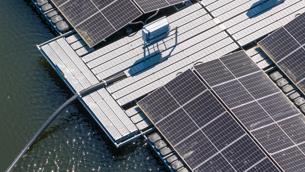 Aerial view of floating solar panels installed on a water surface with connecting walkways and electrical equipment in Zwolle Overijssel Netherlands. Aerial view of floating solar panels installed on a water surface with connecting walkways and electrical equipment in Zwolle Overijssel Netherlands.