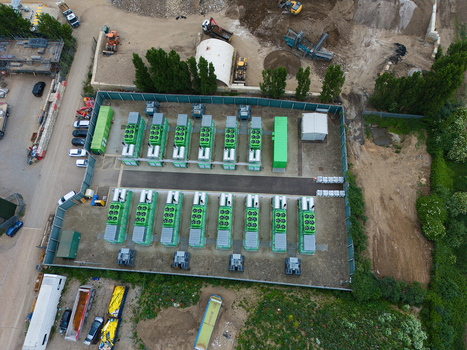 Aerial view of the Damhead Creek Power Station Battery Energy Storage Systems BESS with rows of green units in a fenced area Rochester England United Kingdom. Aerial view of the Damhead Creek Power Station Battery Energy Storage Systems BESS with rows of green units in a fenced area Rochester England United Kingdom.