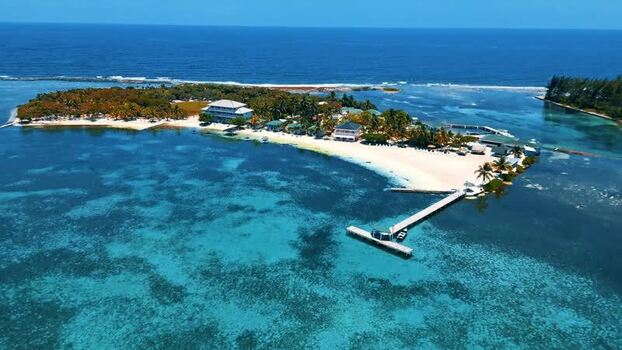 Aerial view of Guanaja island with white sand beaches and coral reefs Honduras. Aerial view of Guanaja island with white sand beaches and coral reefs Honduras.