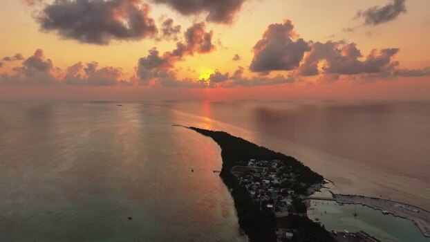 Aerial view of the tropical island of Fulhadhoo at sunset Maldives. Aerial view of the tropical island of Fulhadhoo at sunset Maldives.