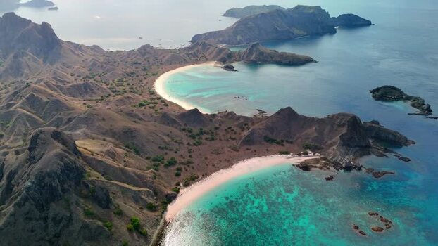 Aerial view of Komodo National Park with rugged hills and bays Indonesia. Aerial view of Komodo National Park with rugged hills and bays Indonesia.