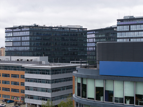 Aerial view of modern office buildings with glass facades and brick cladding in a business park in Krakow Lesser Poland Voivode Poland.