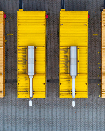 Aerial view of AI data center containers with metallic cooling units arranged on paved ground in Warsaw Masovian Voivodeship Poland. Aerial view of AI data center containers with metallic cooling units arranged on paved ground in Warsaw Masovian Voivodeship Poland.