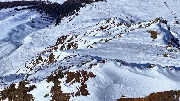 Aerial view of snowy mountain peaks in Nauders Austria.