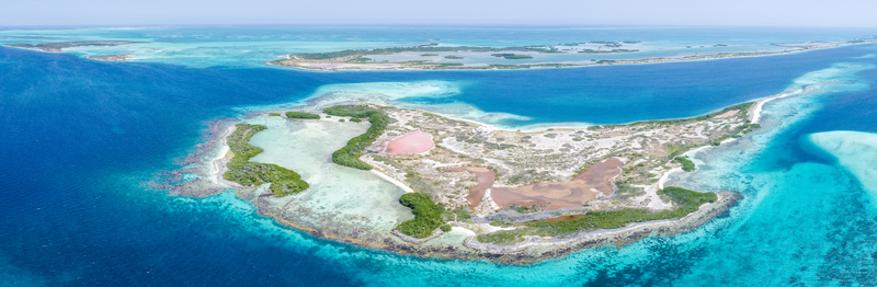 Aerial view of the archipelago featuring turquoise waters coral reefs and small sandy islands with mangrove vegetation Los Roques Dependencias Federales Venezuela. Aerial view of the archipelago featuring turquoise waters coral reefs and small sandy islands with mangrove vegetation Los Roques Dependencias Federales Venezuela.