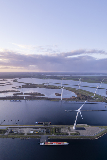 Aerial view of the Krammer locks with wind turbines waterways and a cargo ship in Bruinisse Zeeland Netherlands. Aerial view of the Krammer locks with wind turbines waterways and a cargo ship in Bruinisse Zeeland Netherlands.