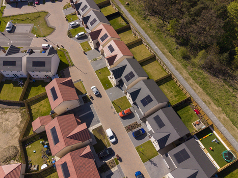 Linlithgow United Kingdom 29 April 2026 Aerial view of a modern residential housing estate with solar panels on rooftops and cars parked along the street. Linlithgow United Kingdom 29 April 2026 Aerial view of a modern residential housing estate with solar panels on rooftops and cars parked along the street.