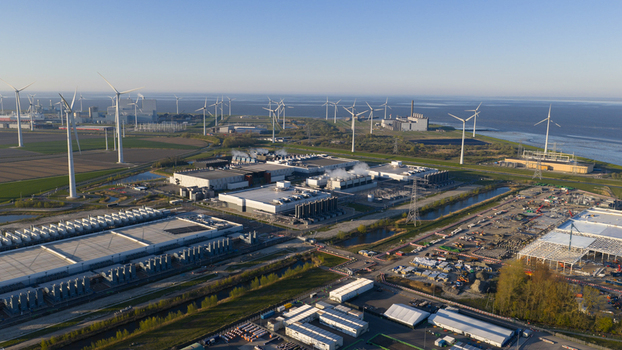 Drone view of a hyperscale data center in Eemshaven showing cloud computing server infrastructure cooling systems backup power and digital connectivity. Drone view of a hyperscale data center in Eemshaven showing cloud computing server infrastructure cooling systems backup power and digital connectivity.