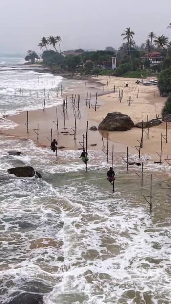Aerial view of stilt fishermen on the coast of Koggala Sri Lanka. Aerial view of stilt fishermen on the coast of Koggala Sri Lanka.
