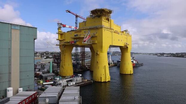 Aerial view of a massive yellow offshore platform Norway.