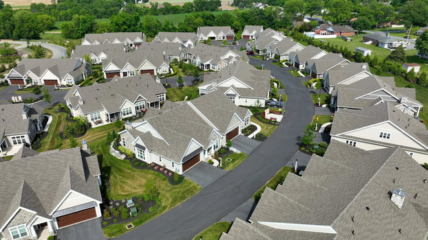 Aerial view of a retirement community campus in West Lampeter Township with residential houses manicured lawns and winding roads in Willow Street Pennsylvania United States.