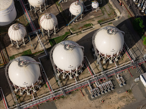 Aerial view of industrial spherical gas storage tanks at a refinery facility in Bajos de Haina San Cristobal Province Dominican Republic.