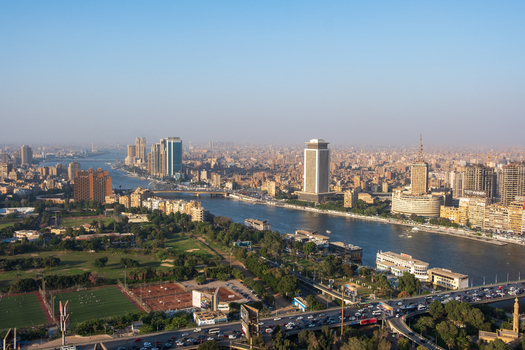 Cairo Egypt 19 October 2025 View of the Nile River winding through the vibrant cityscape framed by modern buildings and lush greenery under a bright sky. Cairo Egypt 19 October 2025 View of the Nile River winding through the vibrant cityscape framed by modern buildings and lush greenery under a bright sky.