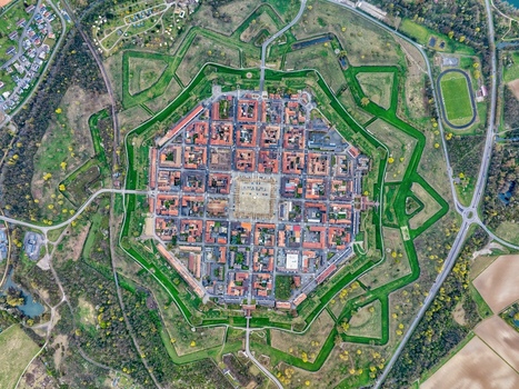 Aerial view of the octagonal fortress city with its star shaped walls and grid patterned streets a testament to military engineering Neuf Brisach Grand Est France.
