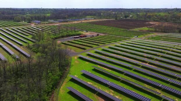 Aerial view of a large solar farm with rows of panels United States. Aerial view of a large solar farm with rows of panels United States.
