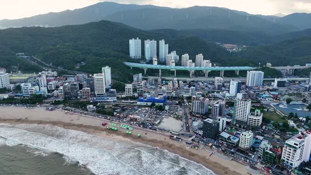 Aerial view of Songjeong dong beach and urban landscape in South Korea. Aerial view of Songjeong dong beach and urban landscape in South Korea.