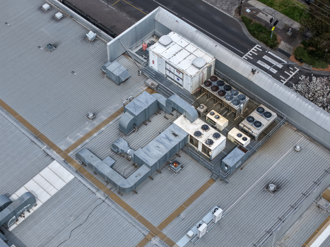 Melbourne VIC Australia 25 September 2026 Aerial view of industrial rooftop with HVAC units ventilation ducts and metal roofing.