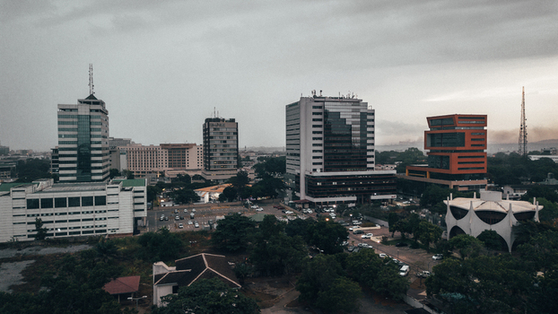 Accra Ghana 25 July 2024 Aerial view of the Ecobank Ghana Plc head office and surrounding modern office buildings in the city skyline under a cloudy sky. Accra Ghana 25 July 2024 Aerial view of the Ecobank Ghana Plc head office and surrounding modern office buildings in the city skyline under a cloudy sky.