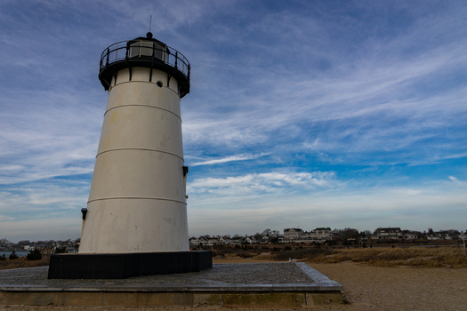 View of the historic Edgartown Harbor Light on Martha s Vineyard with its white tower and stone base under a blue sky Edgartown Massachusetts United States.
