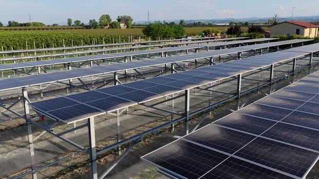 Aerial view of solar panels in a field in Italy.