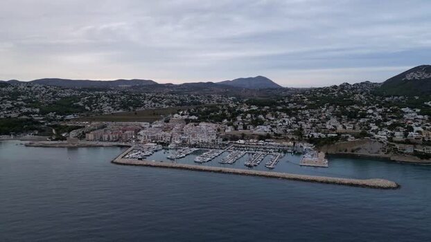 Aerial view of Moraira marina and coastal town Spain.
