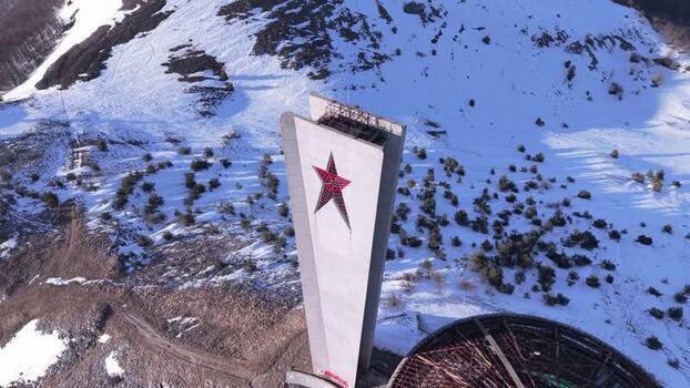 Aerial view of Buzludzha Monument on a snowy mountain Bulgaria.