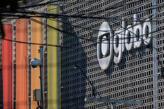 Rio de Janeiro Brazil 07 June 2026 View of the TV Globo Jardim Botanico building facade featuring the iconic logo colorful banners and security cameras behind power lines.