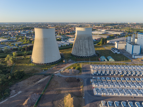 Aerial view of the Cargovil battery energy storage system and industrial cooling towers in an urban landscape in Vilvoorde Vlaanderen Belgium. Aerial view of the Cargovil battery energy storage system and industrial cooling towers in an urban landscape in Vilvoorde Vlaanderen Belgium.
