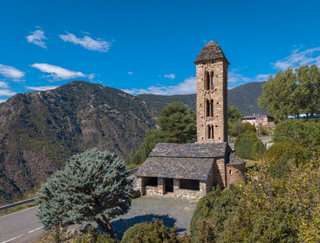 Aerial view of the Romanesque Sant Miquel d Engolasters church with its stone bell tower and slate roof set against mountains in Engolasters Escaldes Engordany Andorra. Aerial view of the Romanesque Sant Miquel d Engolasters church with its stone bell tower and slate roof set against mountains in Engolasters Escaldes Engordany Andorra.