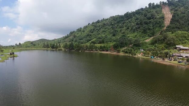 Aerial view of Rawa Gede Jonggol Lake and green hills Indonesia.
