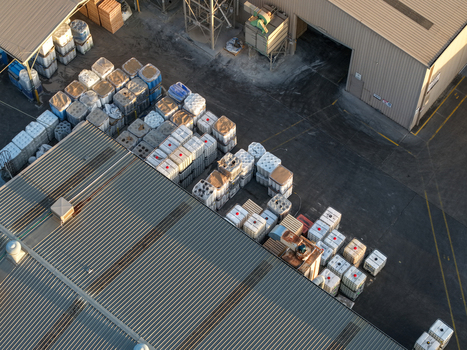 Melbourne Australia 22 September 2026 Aerial view of industrial factory buildings in Kilsyth featuring rows of stacked plastic storage containers and metal roofing. Melbourne Australia 22 September 2026 Aerial view of industrial factory buildings in Kilsyth featuring rows of stacked plastic storage containers and metal roofing.
