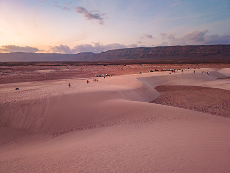 Aerial view of sand dunes rippling under the fading light casting long shadows across the desert landscape Hamlah Socotra Yemen.