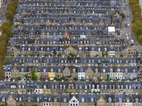 Aerial view of the historic Kartoffelraekkerne terraced houses with uniform rooftops and narrow streets in Copenhagen Denmark. Aerial view of the historic Kartoffelraekkerne terraced houses with uniform rooftops and narrow streets in Copenhagen Denmark.