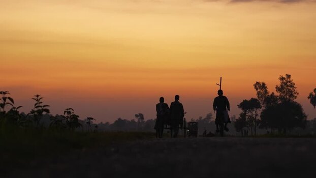 View of people on a cart at sunset in Bogura Bangladesh. View of people on a cart at sunset in Bogura Bangladesh.