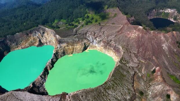 Aerial view of the turquoise crater lakes of Kelimutu National Park Indonesia. Aerial view of the turquoise crater lakes of Kelimutu National Park Indonesia.